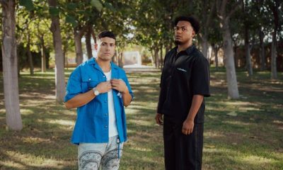 Moa Rivera y Luis Cortés durante la grabación del videoclip de "¿Qué tiene él?" en España. Ambos artistas muestran la conexión musical que caracteriza esta colaboración de salsa moderna producida por Sound Blaster Records.